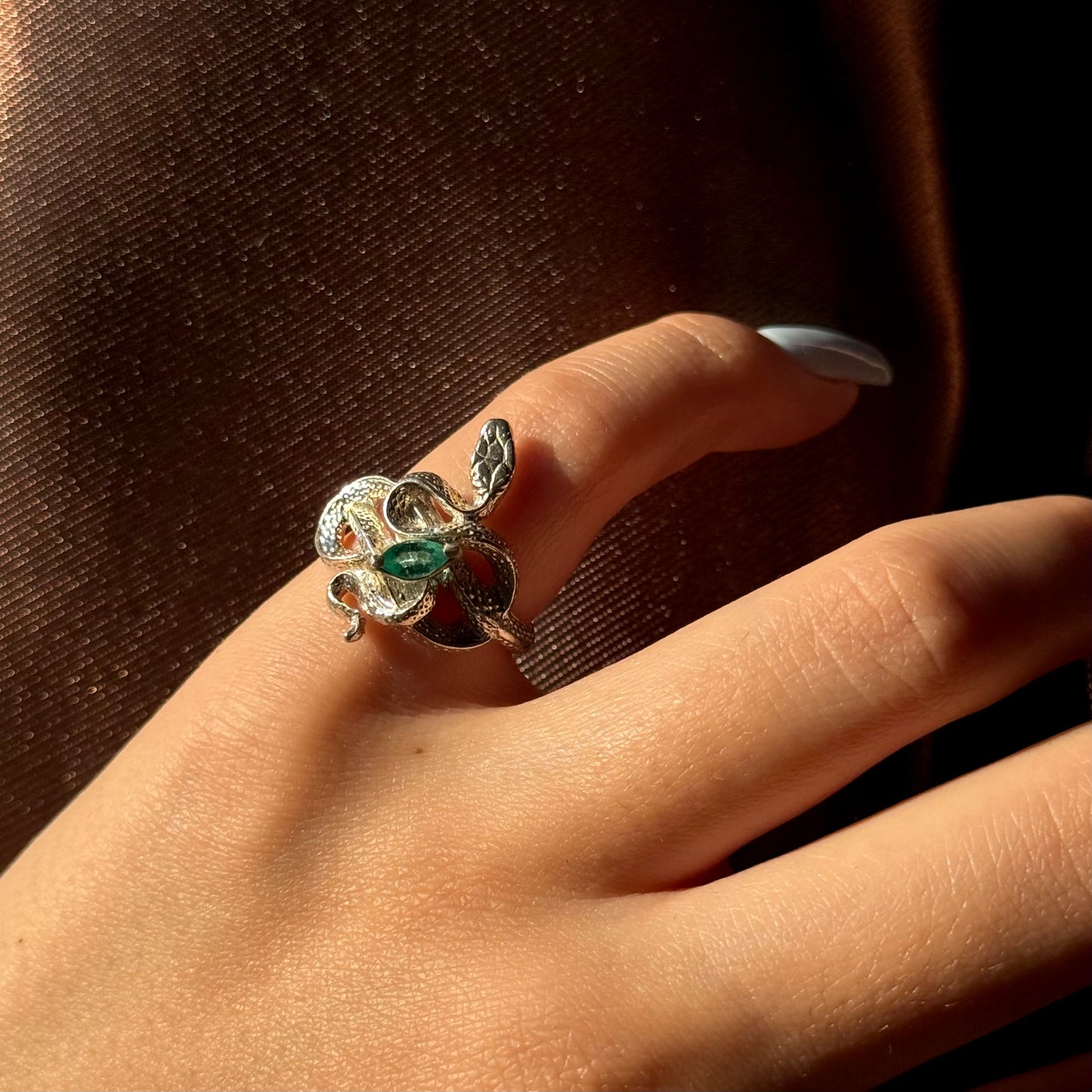 Handmade silver snake ring with intricate detail. Choose amethyst, sapphire, or emerald — each stone carries its own meaning. Crafted with care to last a lifetime