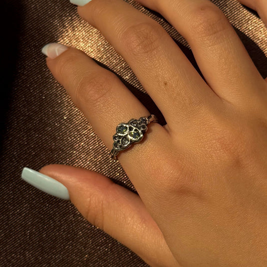 Sterling silver ring with cubic zirconia, featuring a delicate floral-inspired design