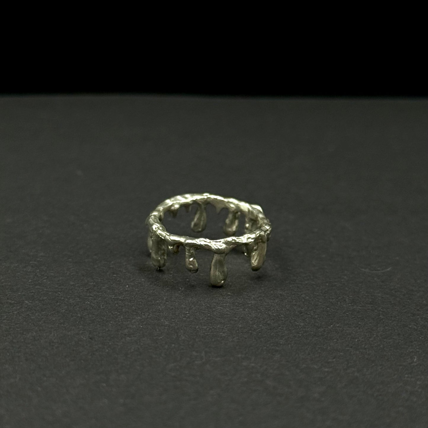 Handmade silver band with unique molten drip design
