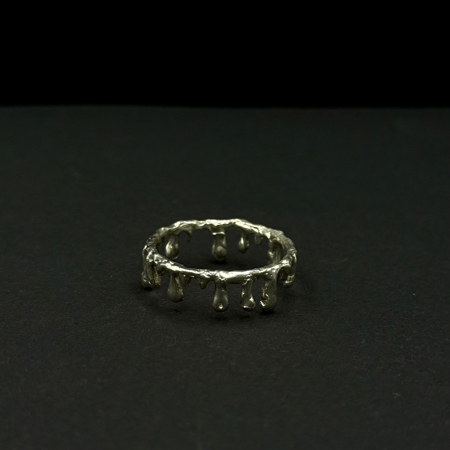 Handmade silver band with unique molten drip design