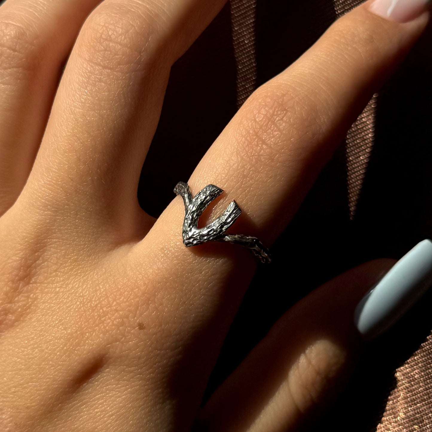 Handmade silver ring with a textured, V-shaped design