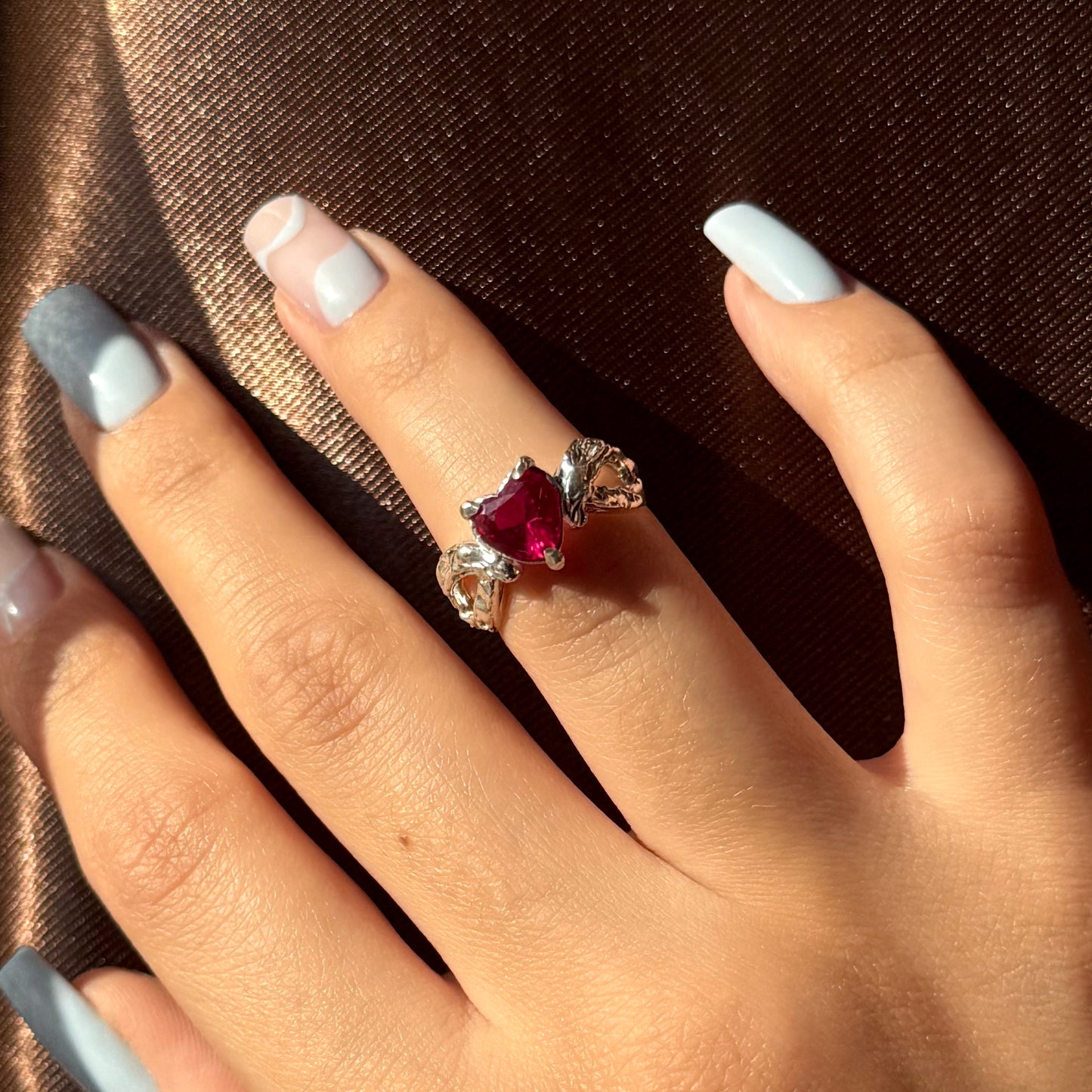 Handmade silver ring with heart-shaped cubic zirconia