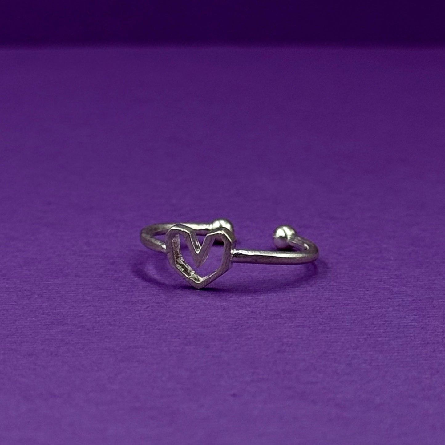 Adjustable silver ring with a heart design
