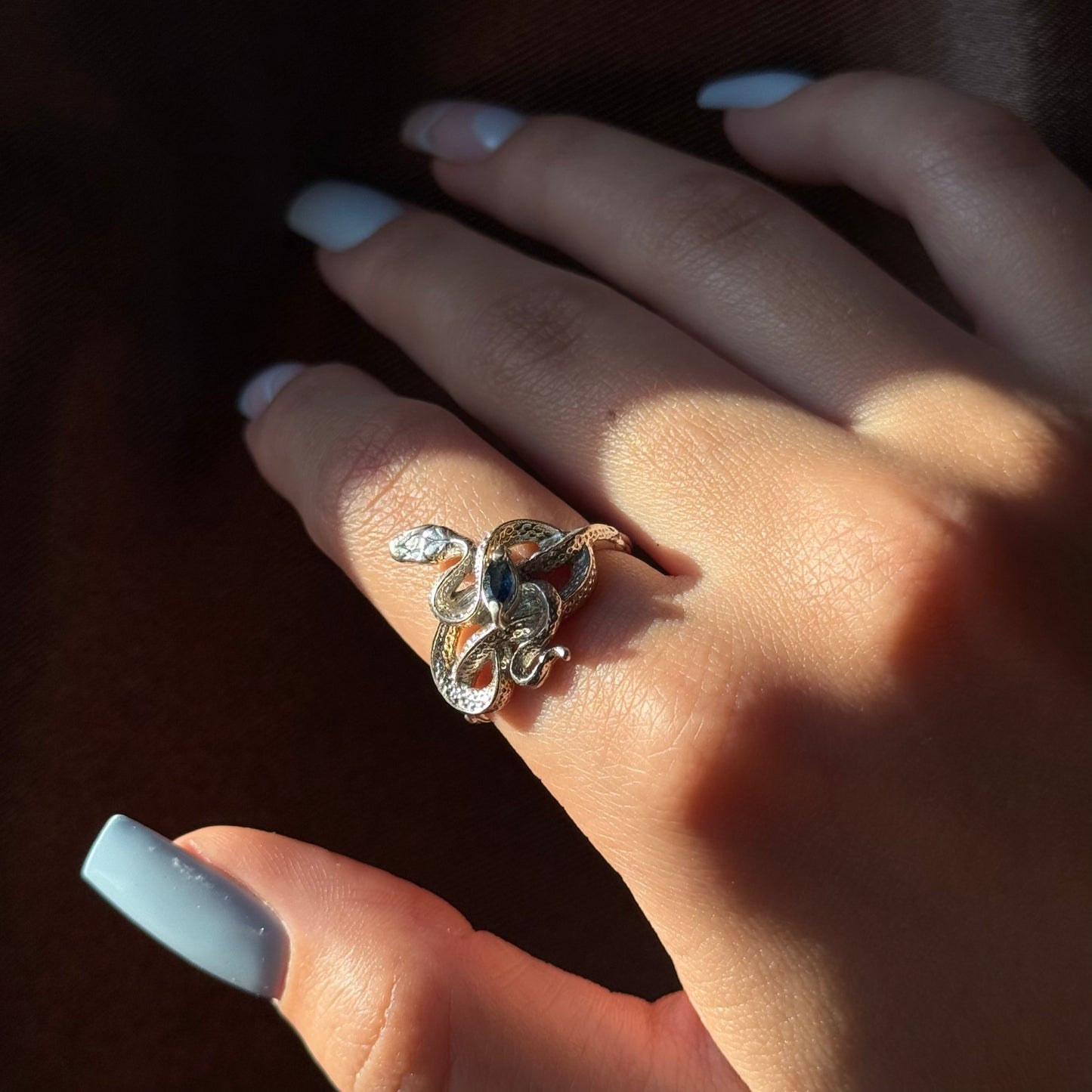 Handmade silver snake ring with intricate detail. Choose amethyst, sapphire, or emerald — each stone carries its own meaning. Crafted with care to last a lifetime