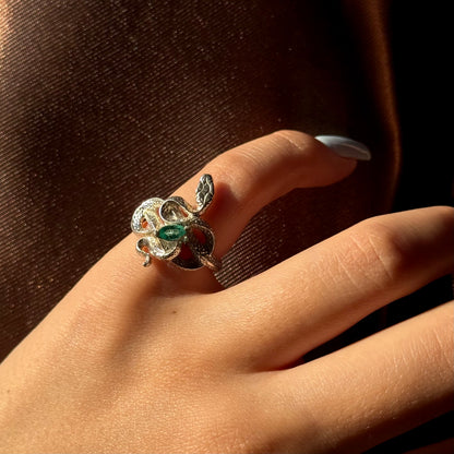 Handmade silver snake ring with intricate detail. Choose amethyst, sapphire, or emerald — each stone carries its own meaning. Crafted with care to last a lifetime