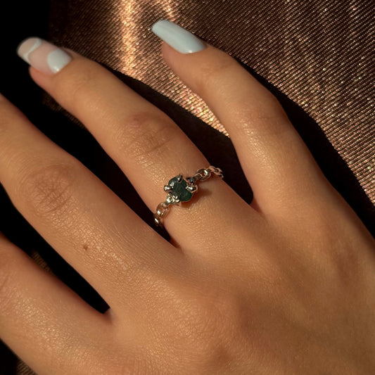 Silver ring with a natural emerald