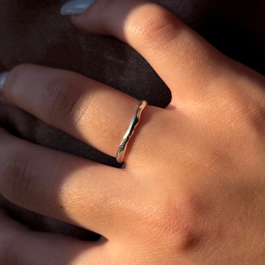 Minimalist sterling silver ring with a wavy texture