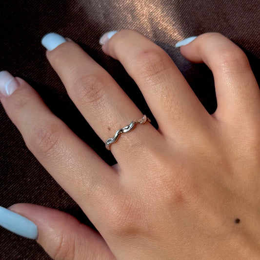 Sterling silver adjustable ring with a textured, organic design