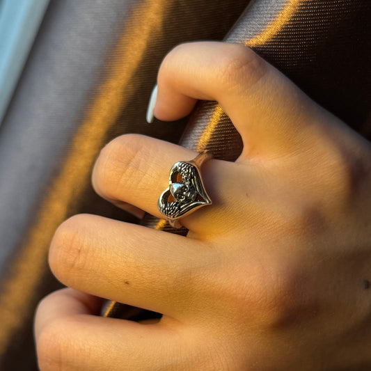 Handmade silver ring with heart-and-skull design