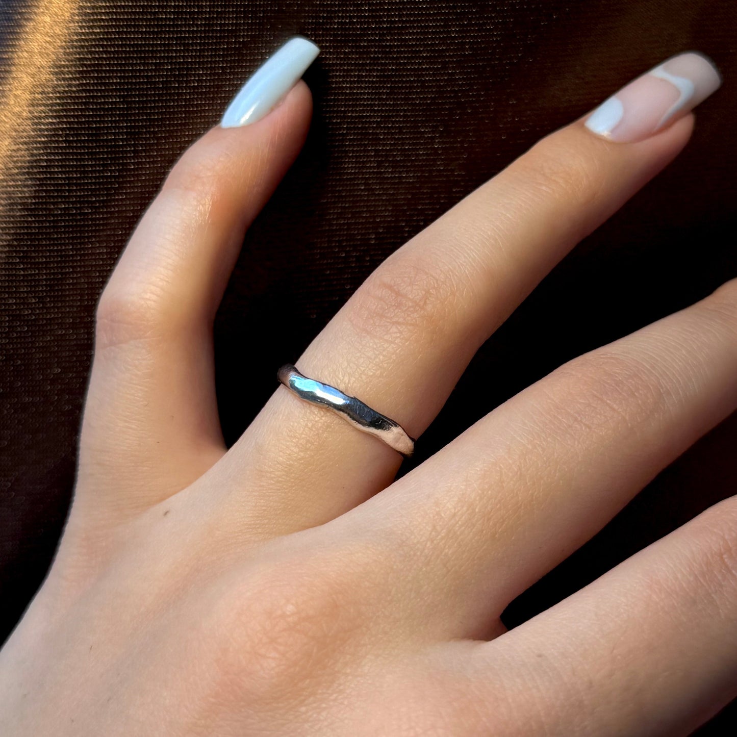 Minimalist sterling silver ring with a wavy texture