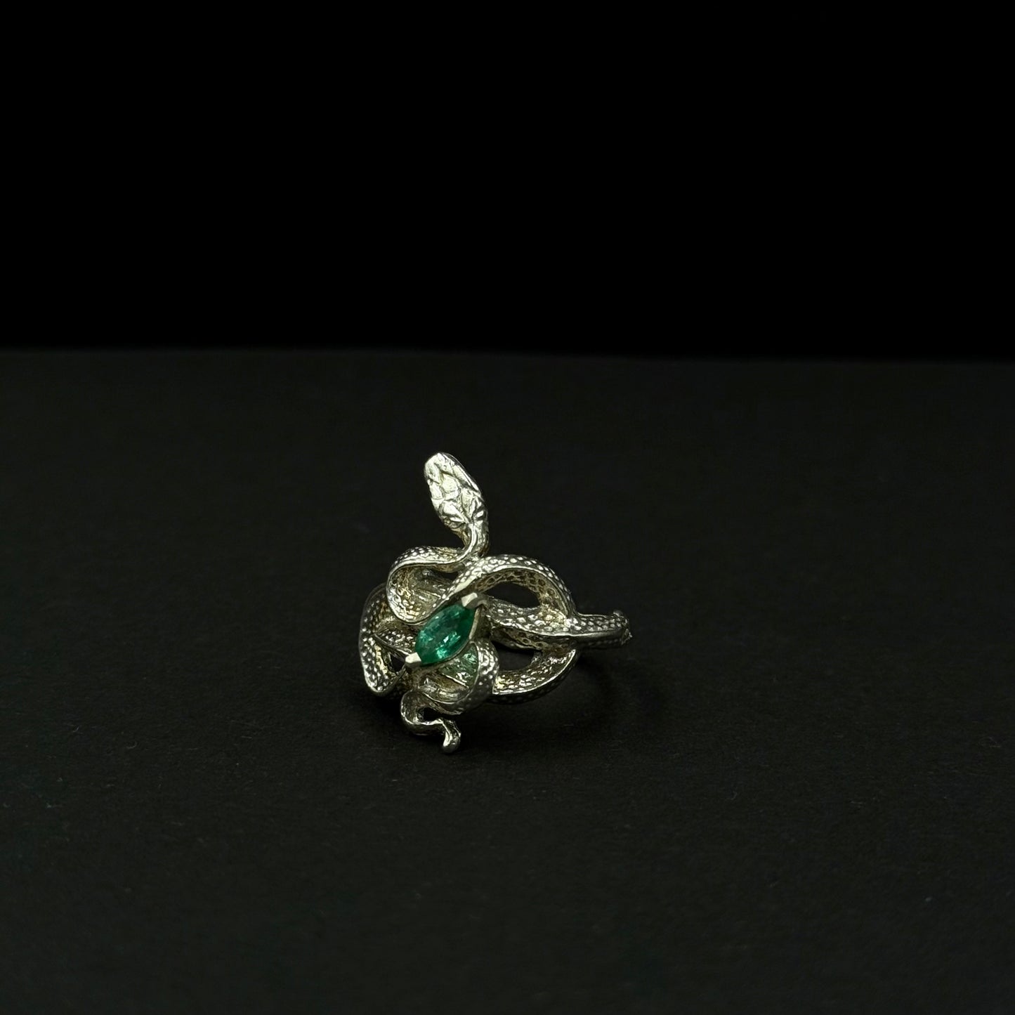 Handmade silver snake ring with intricate detail. Choose amethyst, sapphire, or emerald — each stone carries its own meaning. Crafted with care to last a lifetime