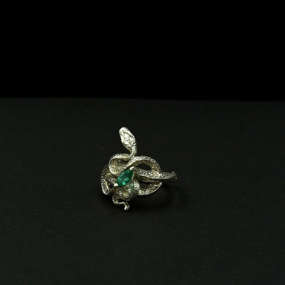 Handmade silver snake ring with intricate detail. Choose amethyst, sapphire, or emerald — each stone carries its own meaning. Crafted with care to last a lifetime