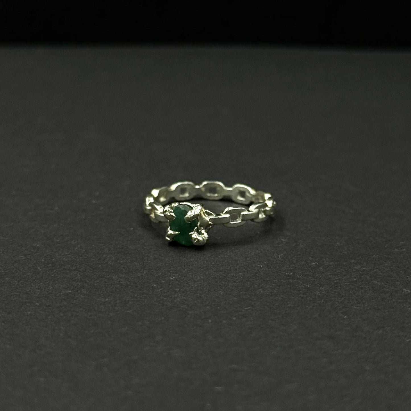Silver ring with a natural emerald