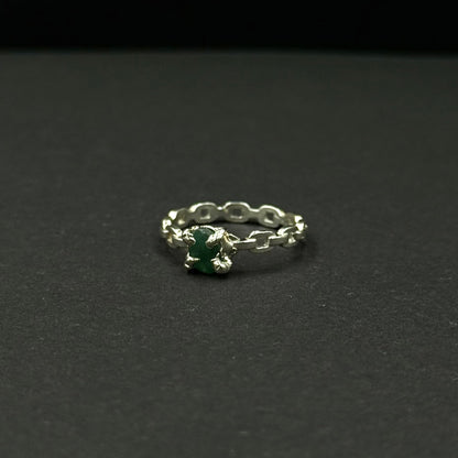 Silver ring with a natural emerald