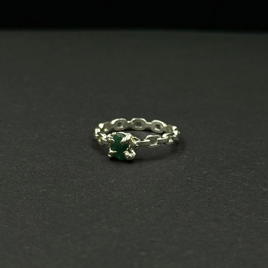 Silver ring with a natural emerald