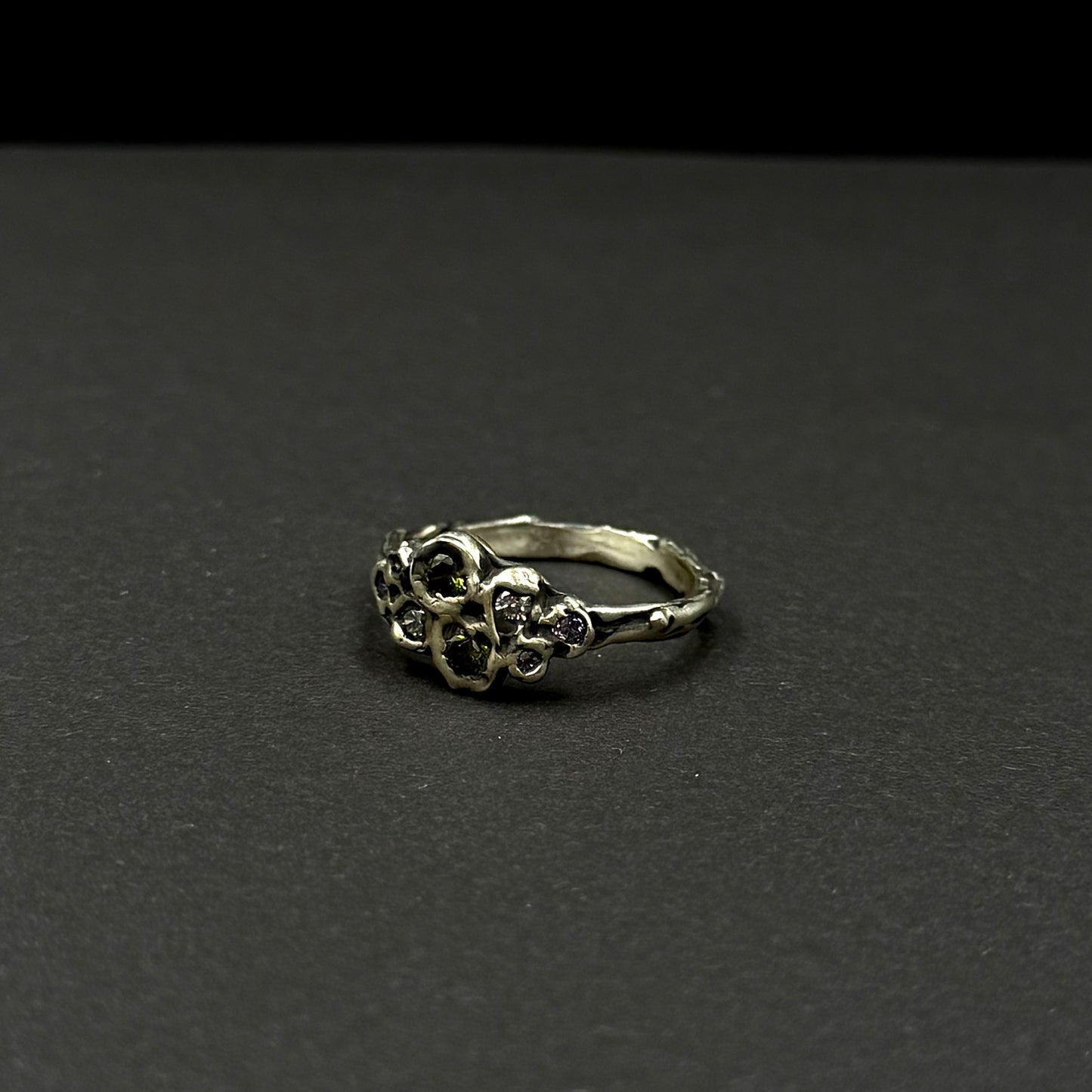 Sterling silver ring with cubic zirconia, featuring a delicate floral-inspired design