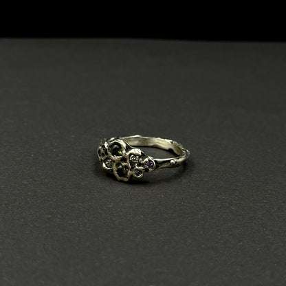 Sterling silver ring with cubic zirconia, featuring a delicate floral-inspired design