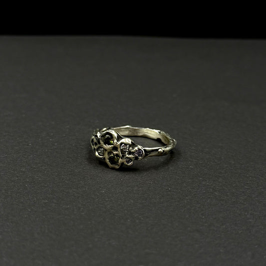 Sterling silver ring with cubic zirconia, featuring a delicate floral-inspired design