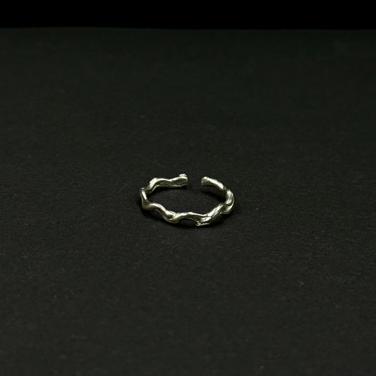 Sterling silver adjustable ring with a textured, organic design