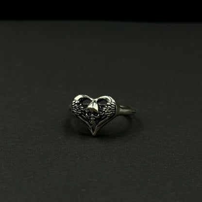 Handmade silver ring with heart-and-skull design