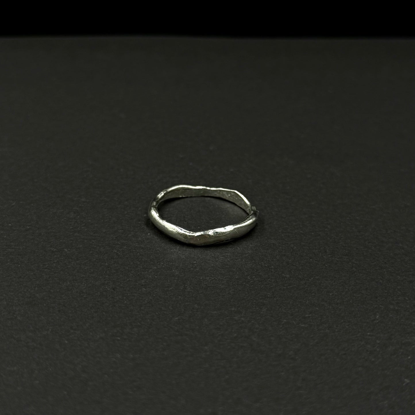 Minimalist sterling silver ring with a wavy texture
