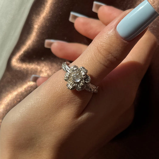 Sterling silver flower ring with a natural moonstone centerpiece