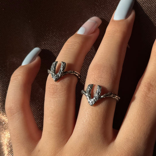 Handmade silver ring with a textured, V-shaped design