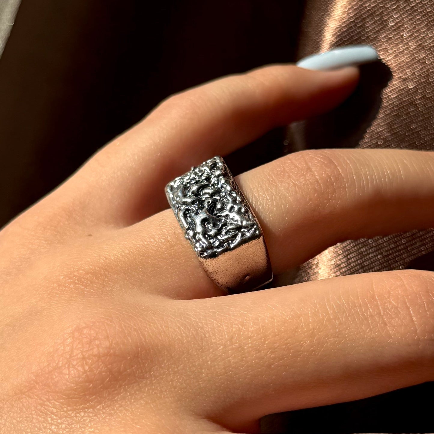 Handmade silver signet ring with textured raw design