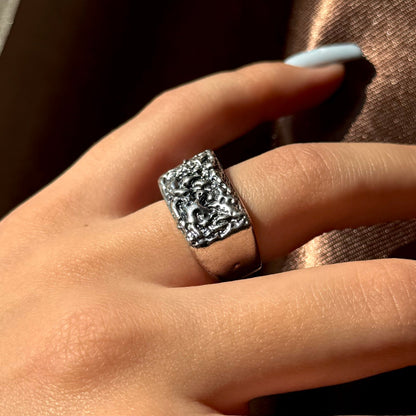 Handmade silver signet ring with textured raw design
