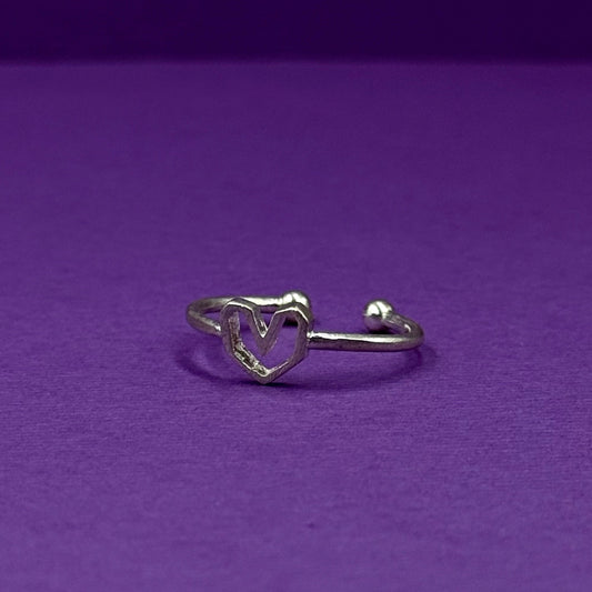 Adjustable silver ring with a heart design