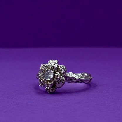 Sterling silver flower ring with a natural moonstone centerpiece
