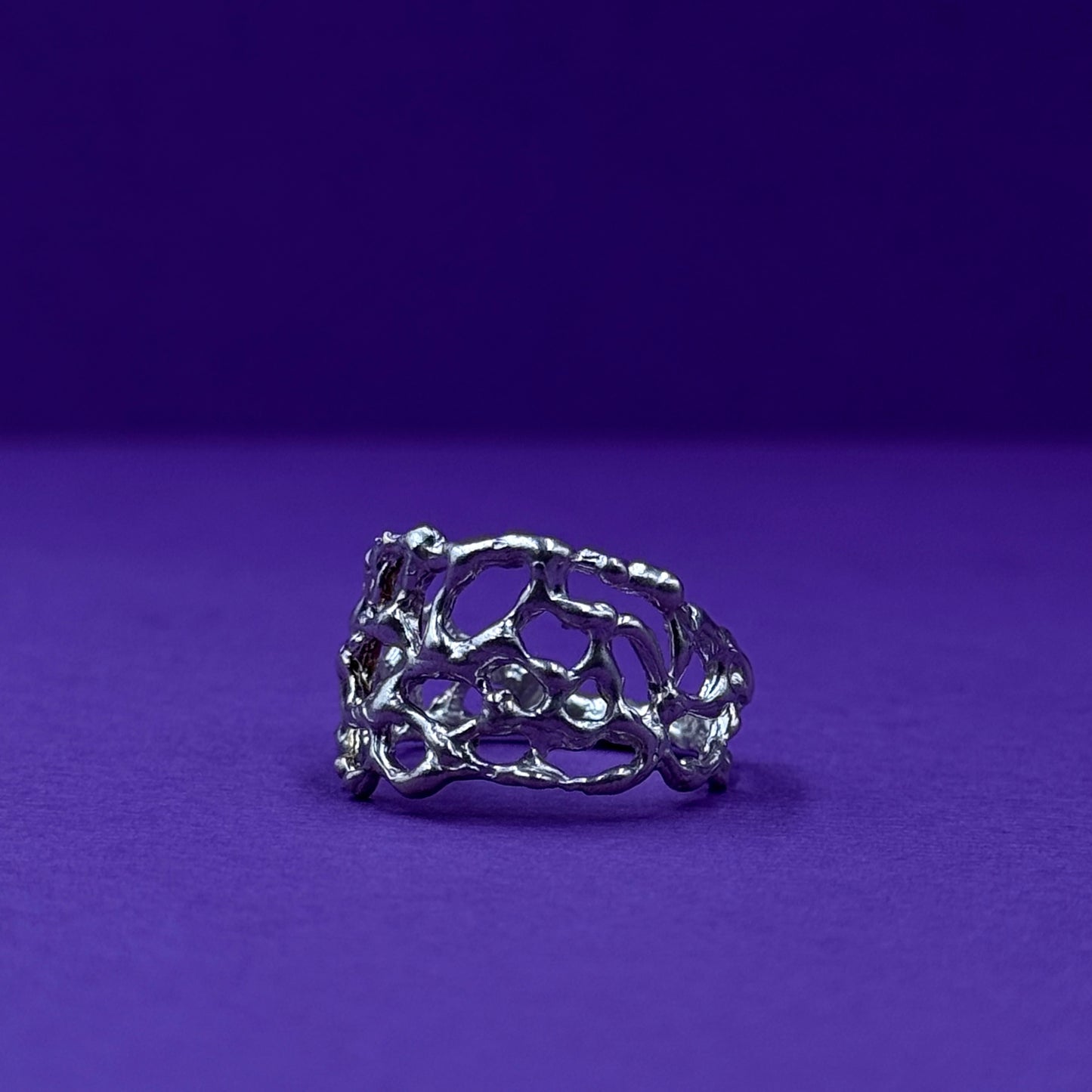 Handmade silver ring with organic openwork design