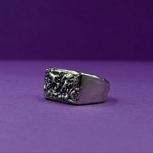 Handmade silver signet ring with textured raw design
