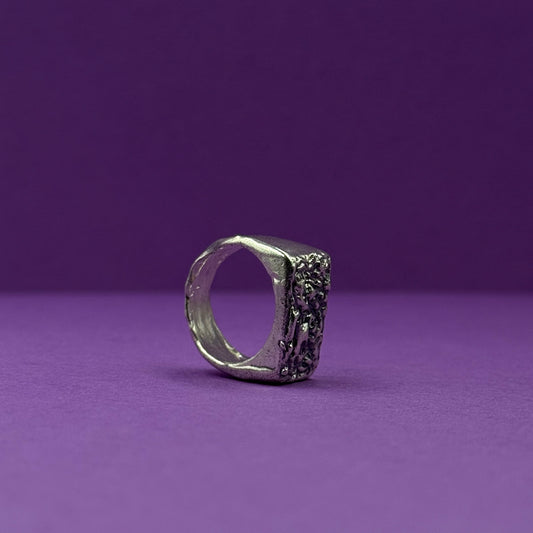 Handmade silver signet ring with textured raw design